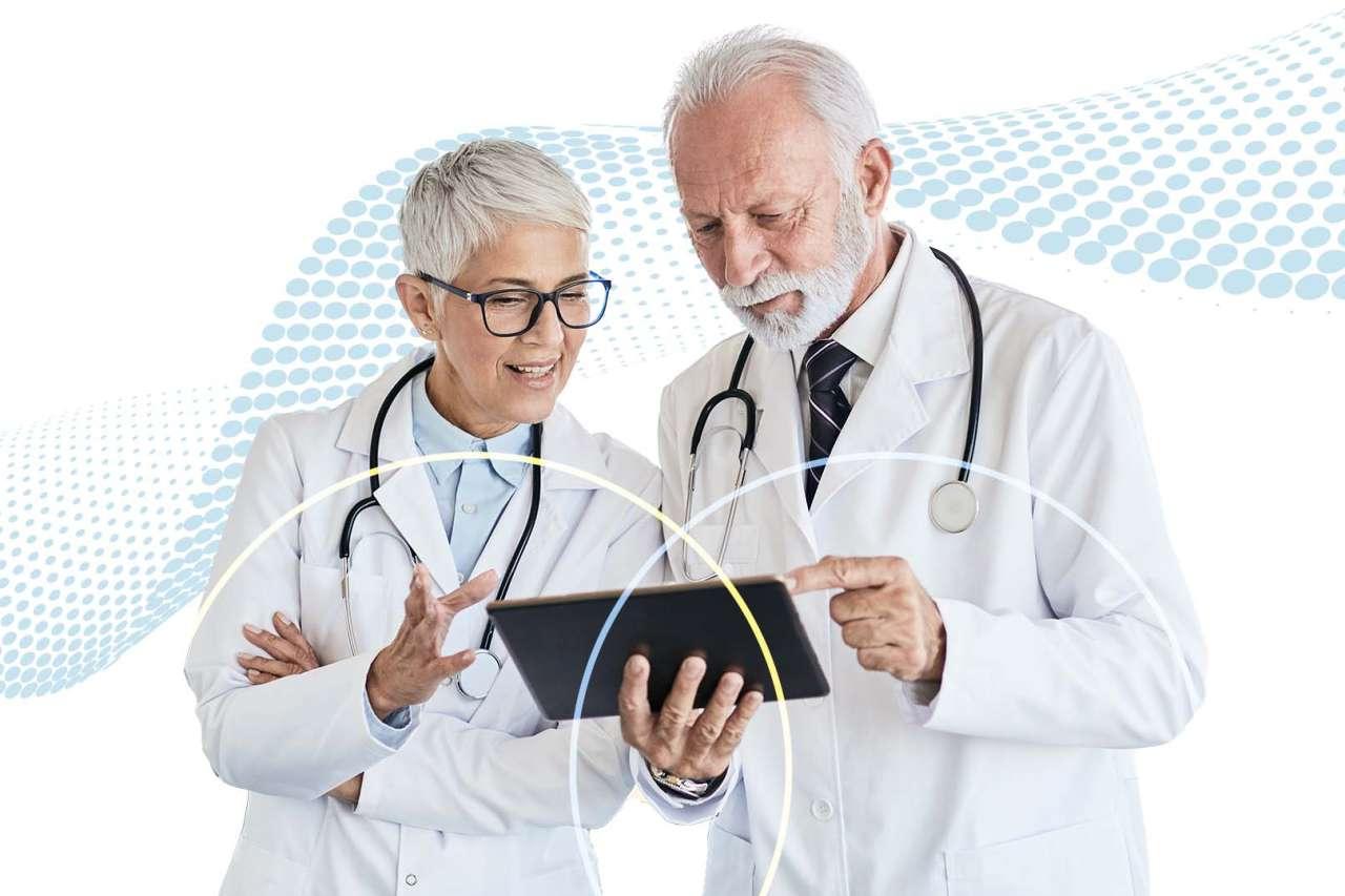 Doctors looking at tablet with soft wave graphic on background.